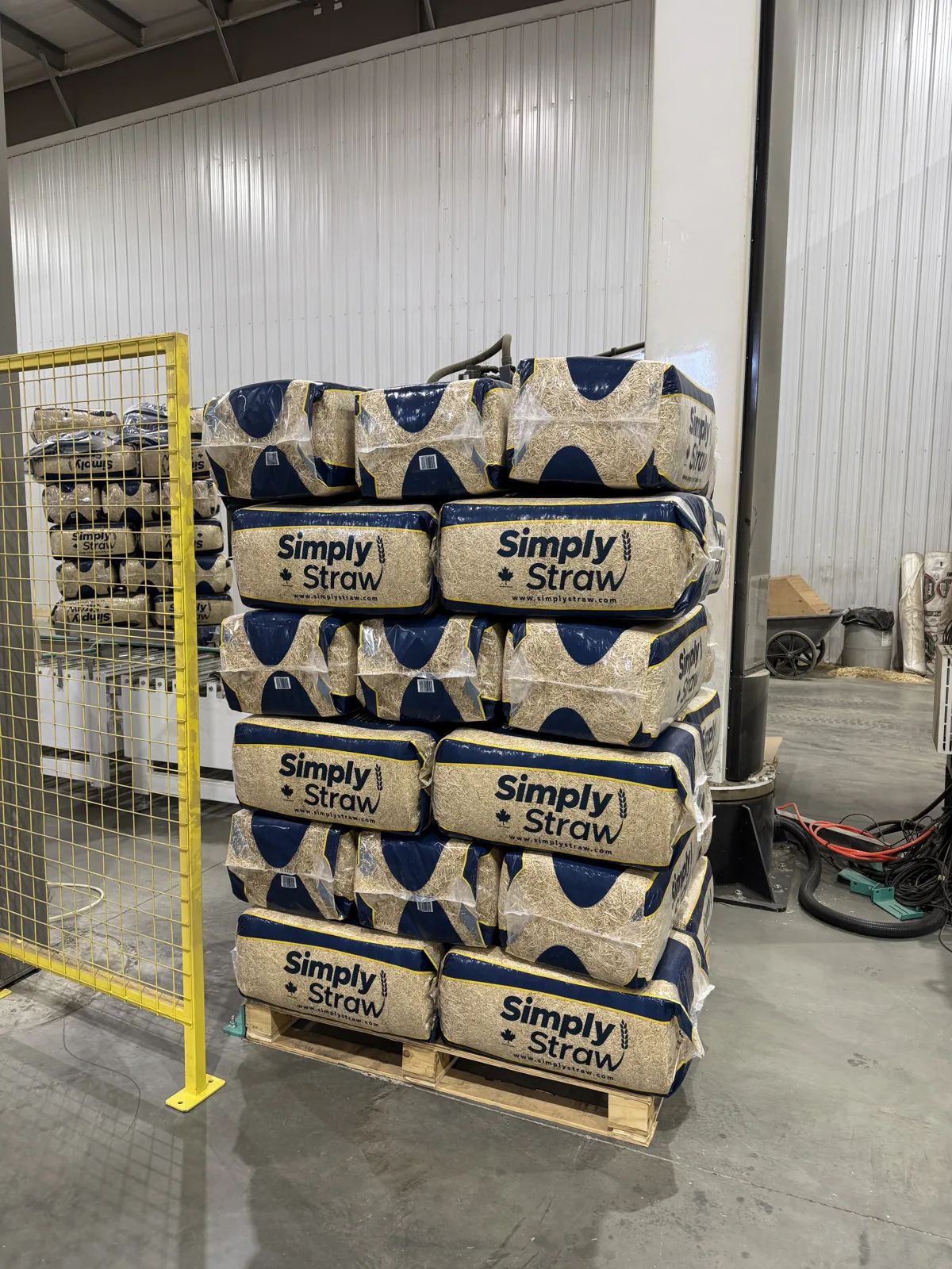 Pallet stacked with Simply Straw 80 L compressed wheat straw bales
